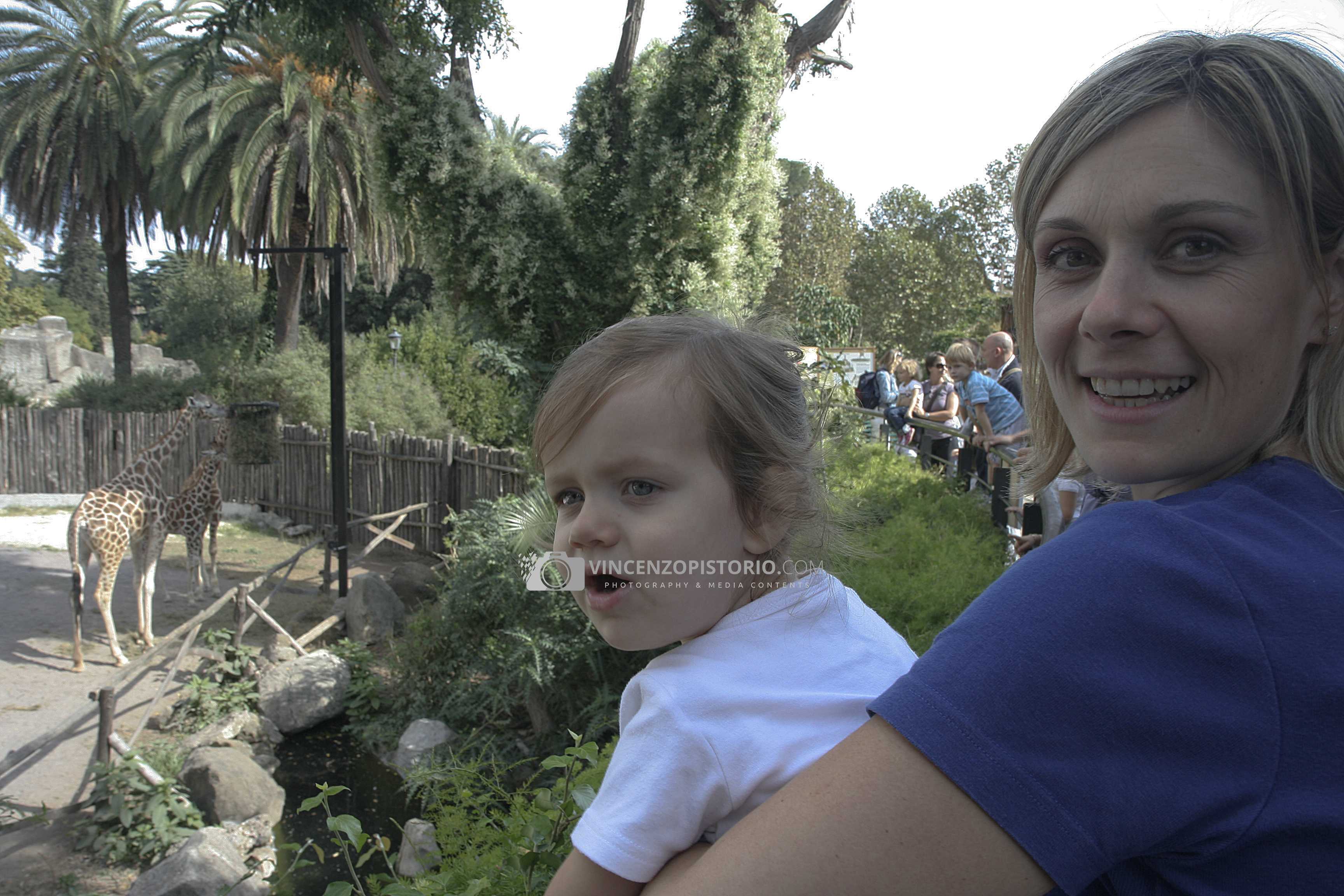 Elisa and mom watching giraffes