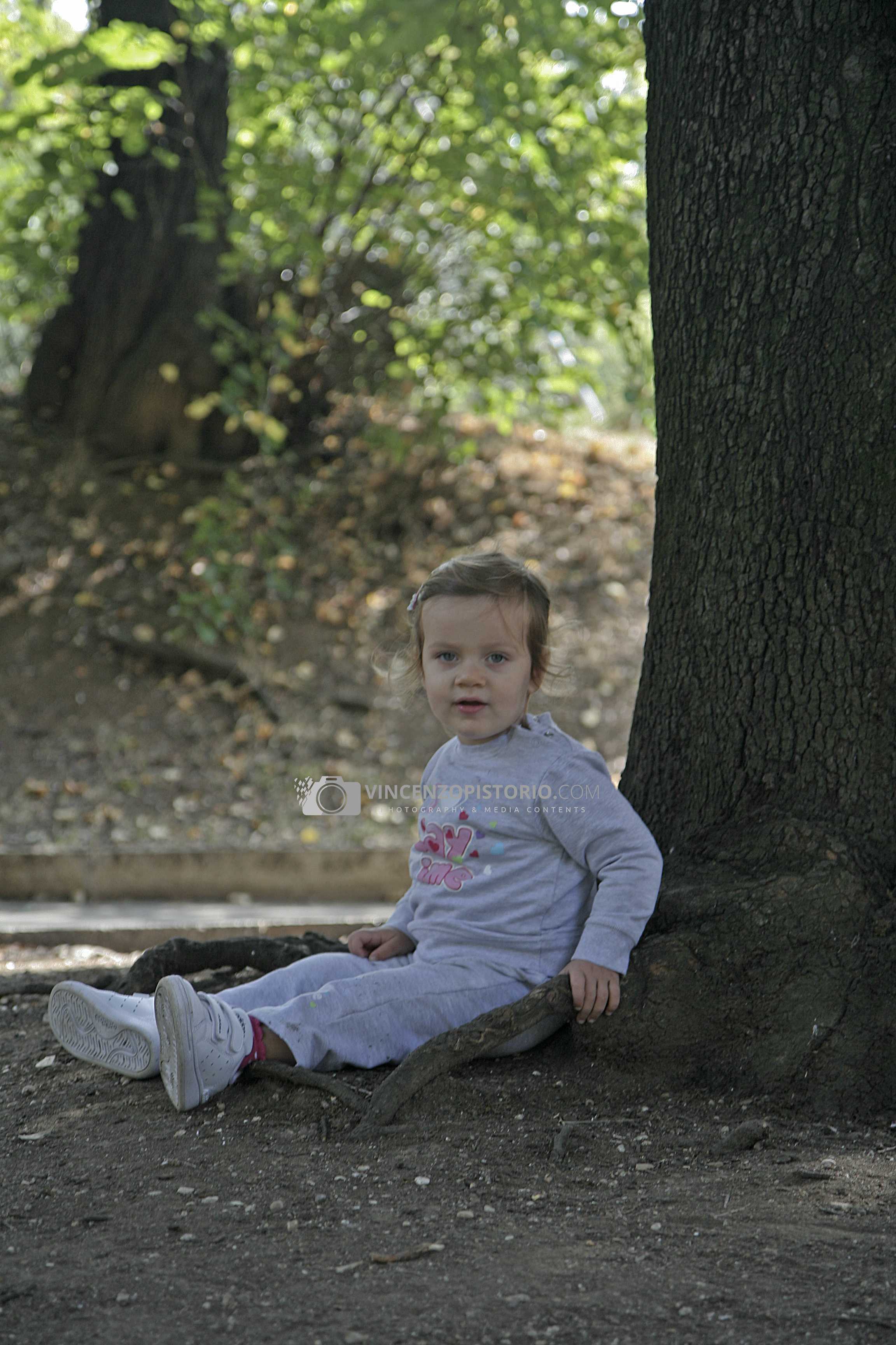 Elisa plays under a tree – 1