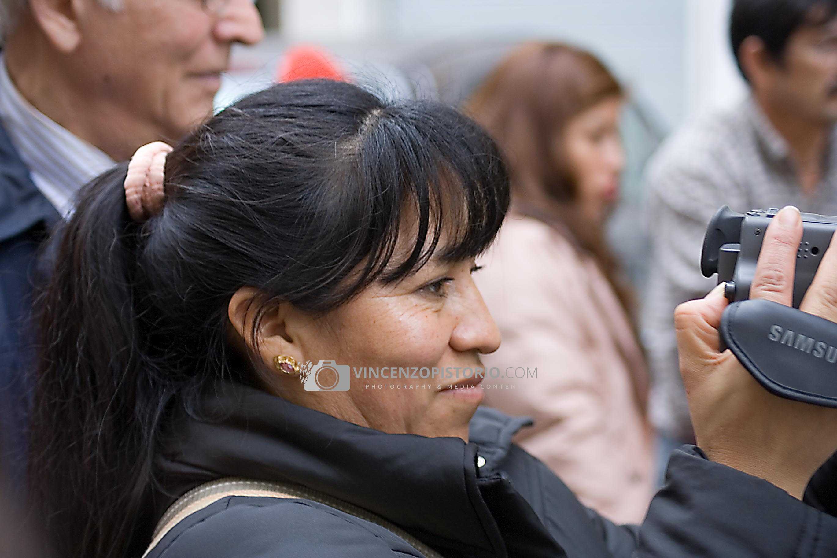 A woman filming the event